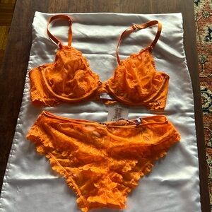 Super cute orange bra and panty set.  New with tags. Never been worn.
